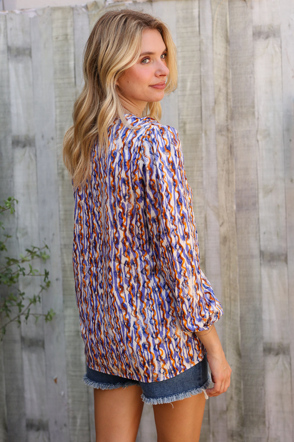 On A Wild Streak V Neck Fabric Button Detail Blouse